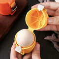 Yellow egg sheller opening an egg by hand 