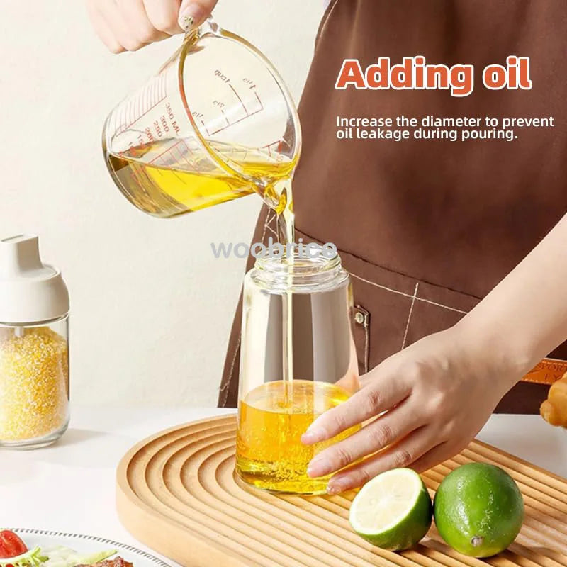 Oil dispenser bottle pouring cooking oil 