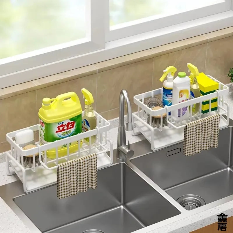 White kitchen sink organizer rack with storage compartments and towel holders 