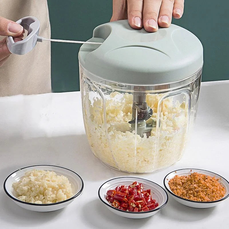 Manual garlic chopper with minced garlic in clear bowl 