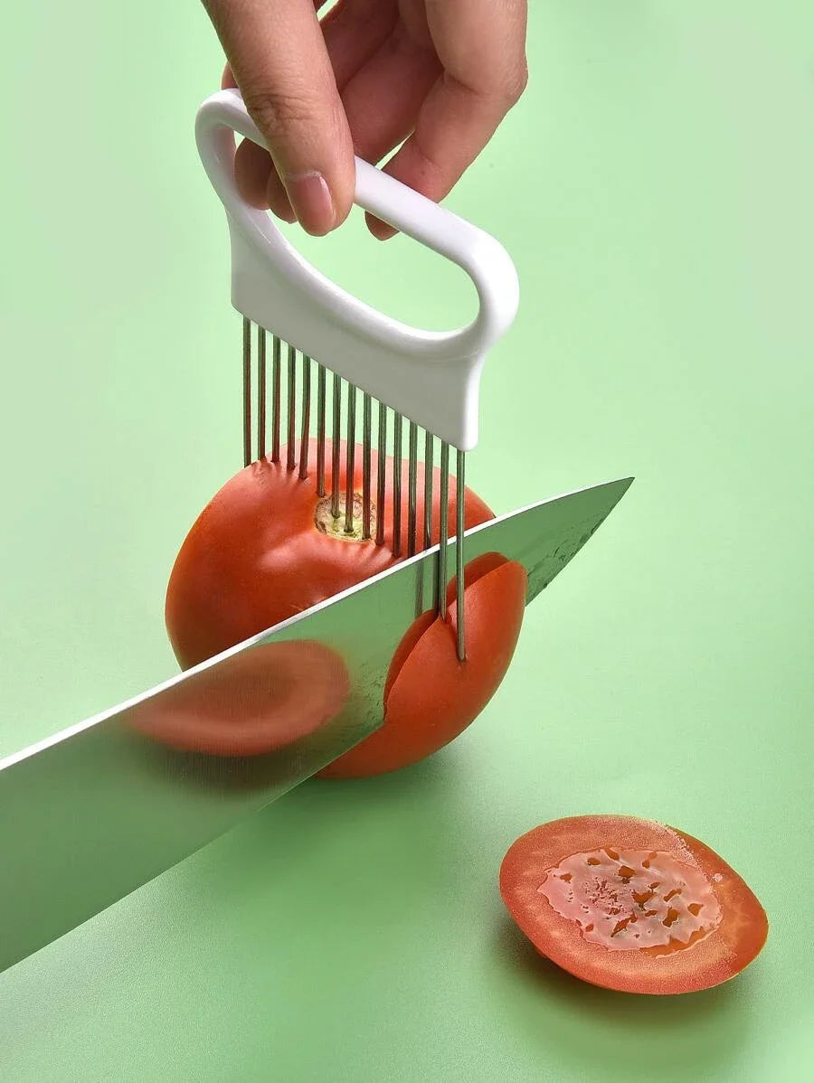 Handheld onion slicer cutting tomato into even sliver 