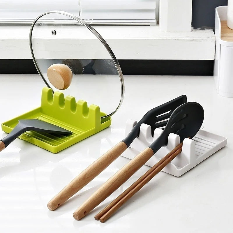 Kitchen utensils with a spoon rest and glass lid 